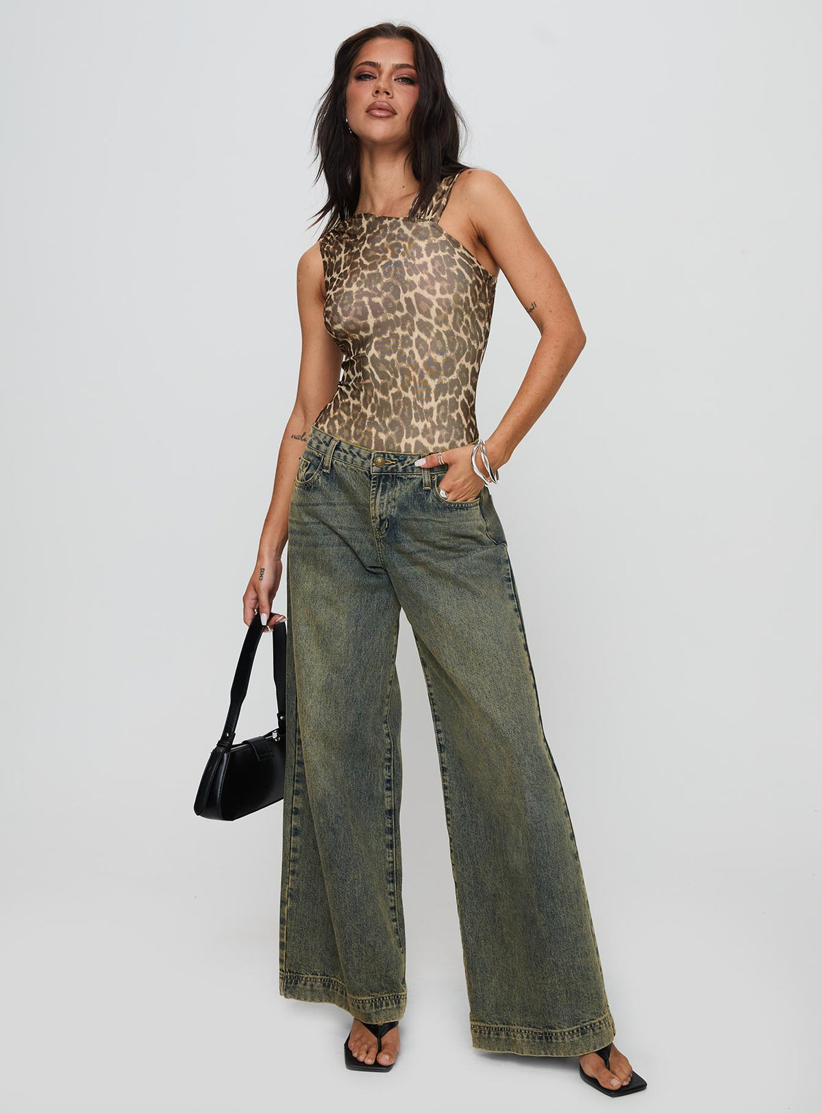 front view of model wearing Princess Polly Serenata Bodysuit Leopard Sleeveless Bodysuit 