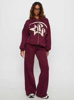Featuring the Stargirl Zip Through Jumper in Burgundy womens jumpers with long oversized design and graphic print front view of model wearing Princess Polly