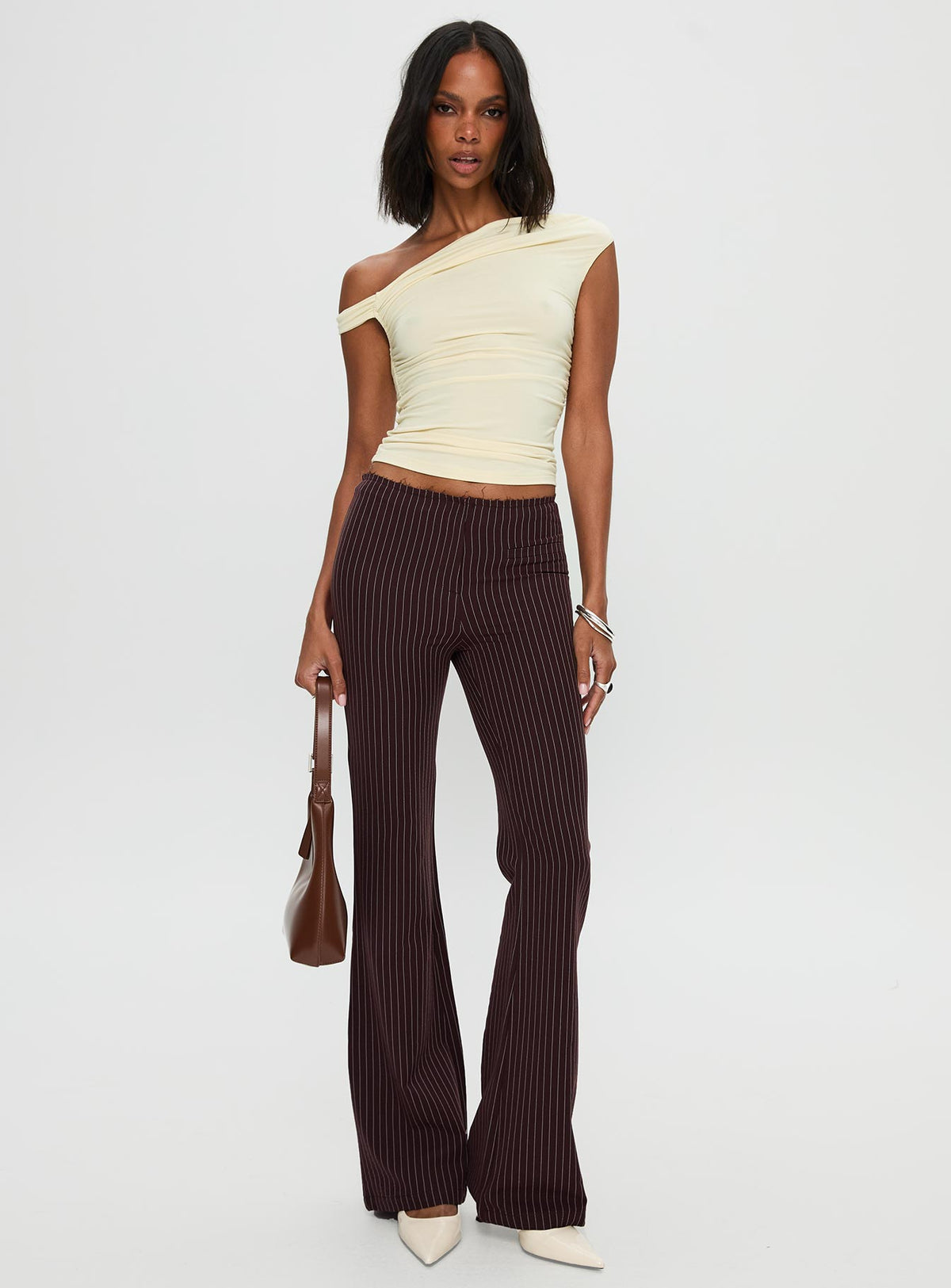 front view of model wearing Princess Polly Sportia Flare Pants Brown High Waisted Pants 