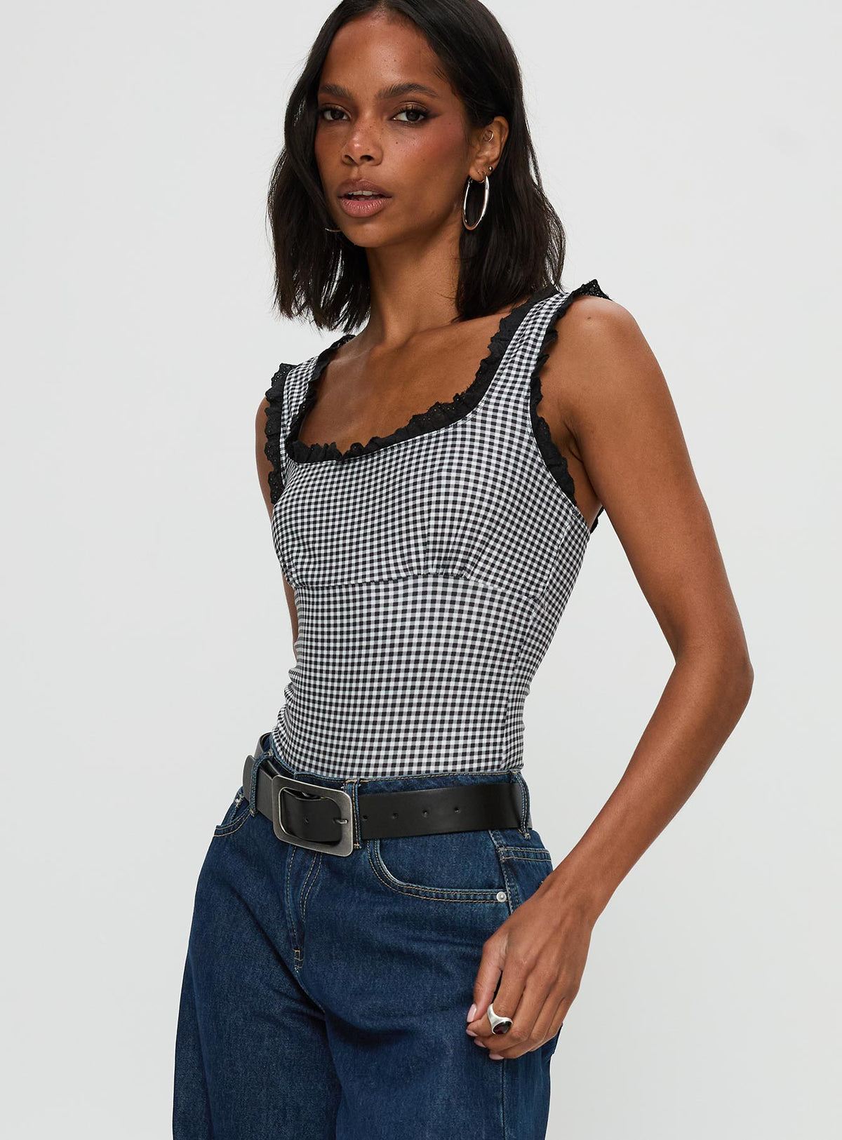 side view of model wearing Princess Polly Trustfund Lace Trim Bodysuit Black / White Check Sleeveless Bodysuit 