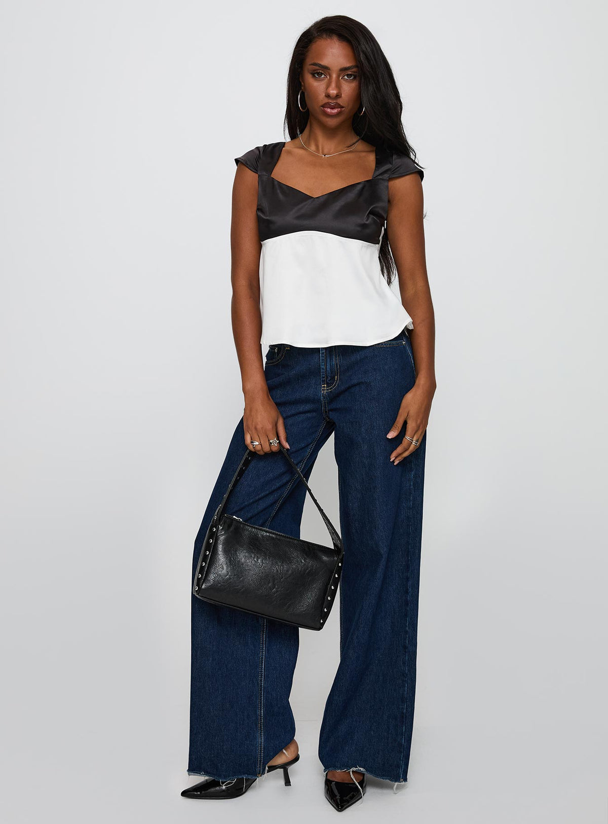 front view of model wearing Princess Polly Think About It Cap Sleeve Top Black / White Short Sleeves V-Neck 