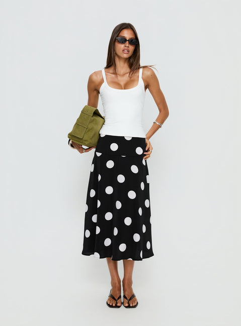   side view of model wearing Princess Polly Picture It Midi Skirt Black Polka Dot Midi Skirts Skirts 