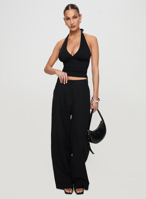 side view of model wearing Princess Polly Whimsy Halter Top Black Sleeveless Plunger 