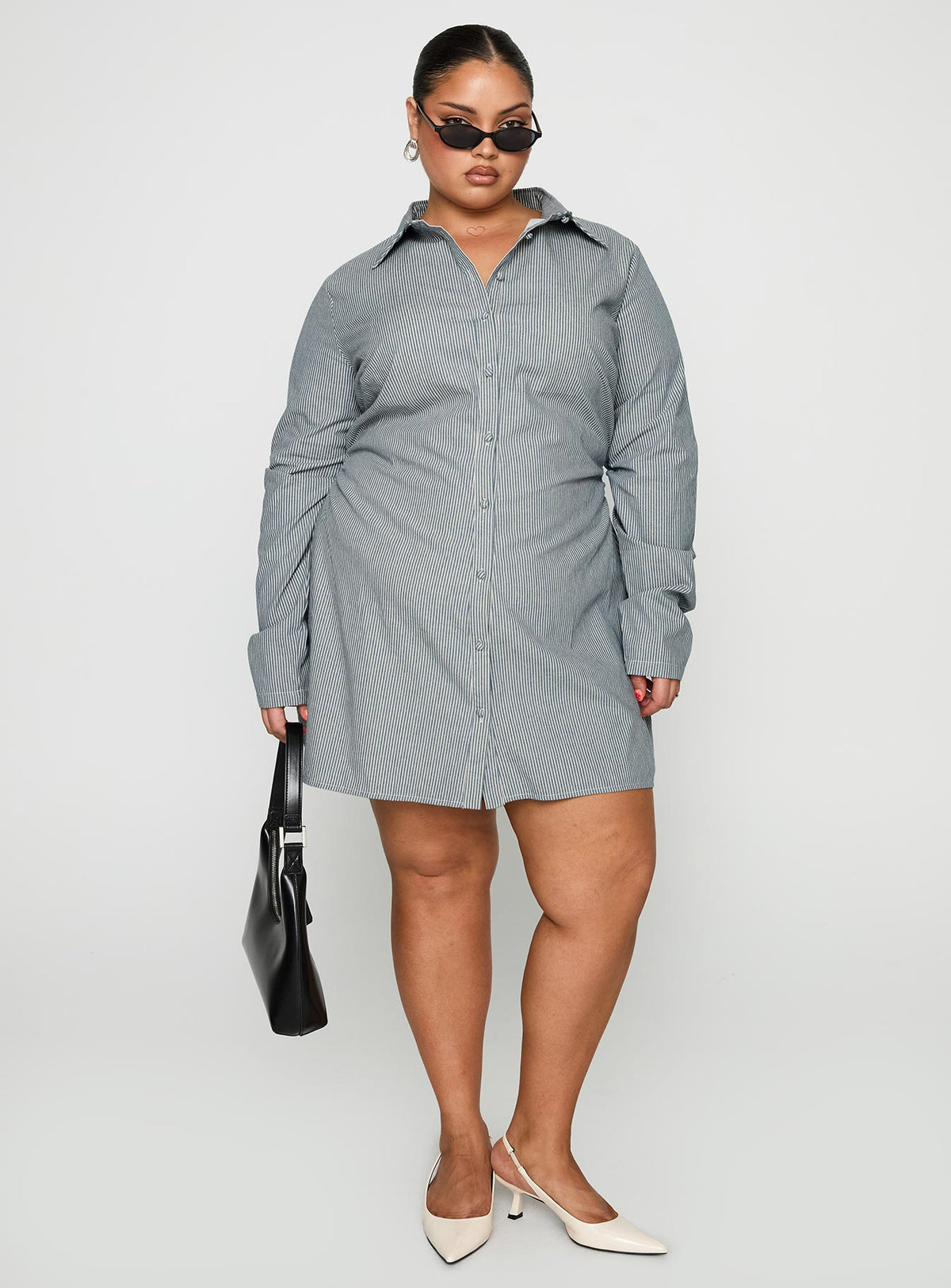 front view of model wearing Princess Polly Publicity Long Sleeve Mini Dress Blue Pinstripe Curve V-Neck 