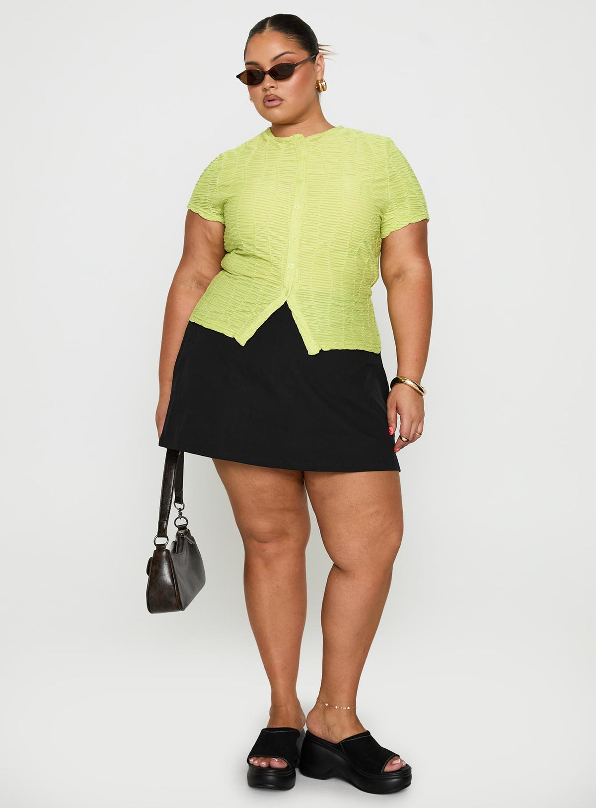 side view of model wearing Princess Polly Suzu Textured Top Green Curve Short Sleeves Crew Neck 