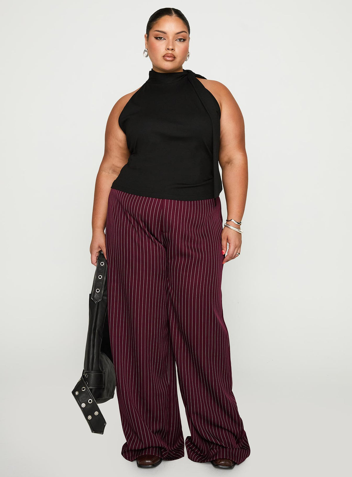 front view of model wearing Princess Polly Mathias Top Black Curve Sleeveless High Neck 