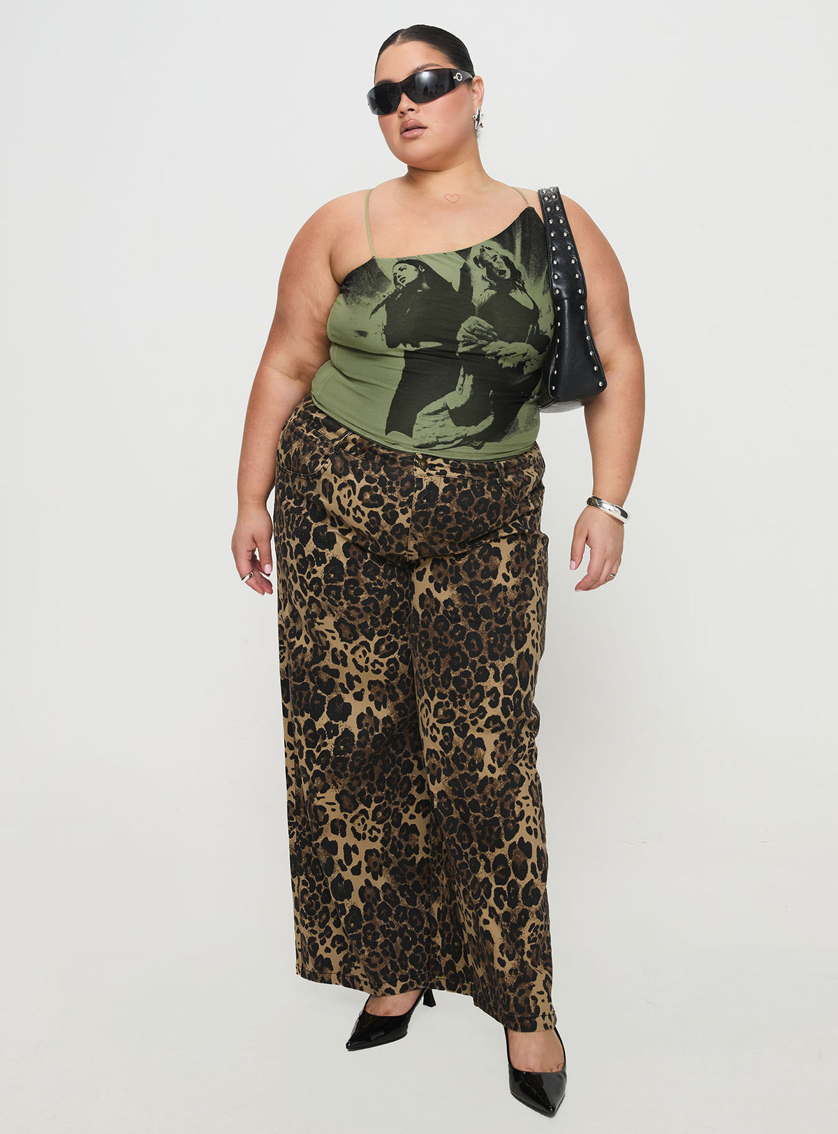 side view of model wearing Princess Polly Pantar Low Rise Pants Leopard Curve Low Rise Pants Pants 