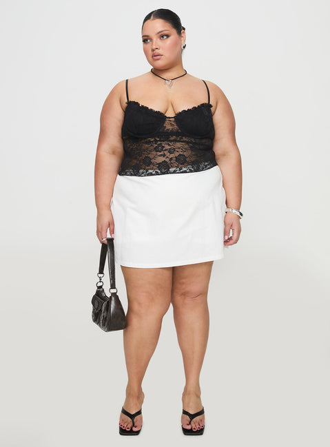 front view of model wearing Princess Polly Gigi Skort White Curve High Waisted Shorts 