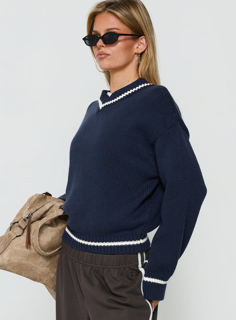Designed with the Myrandah V Neck Long Sleeve Knit Jumper Navy womens jumper with short length side view of model wearing Princess Polly