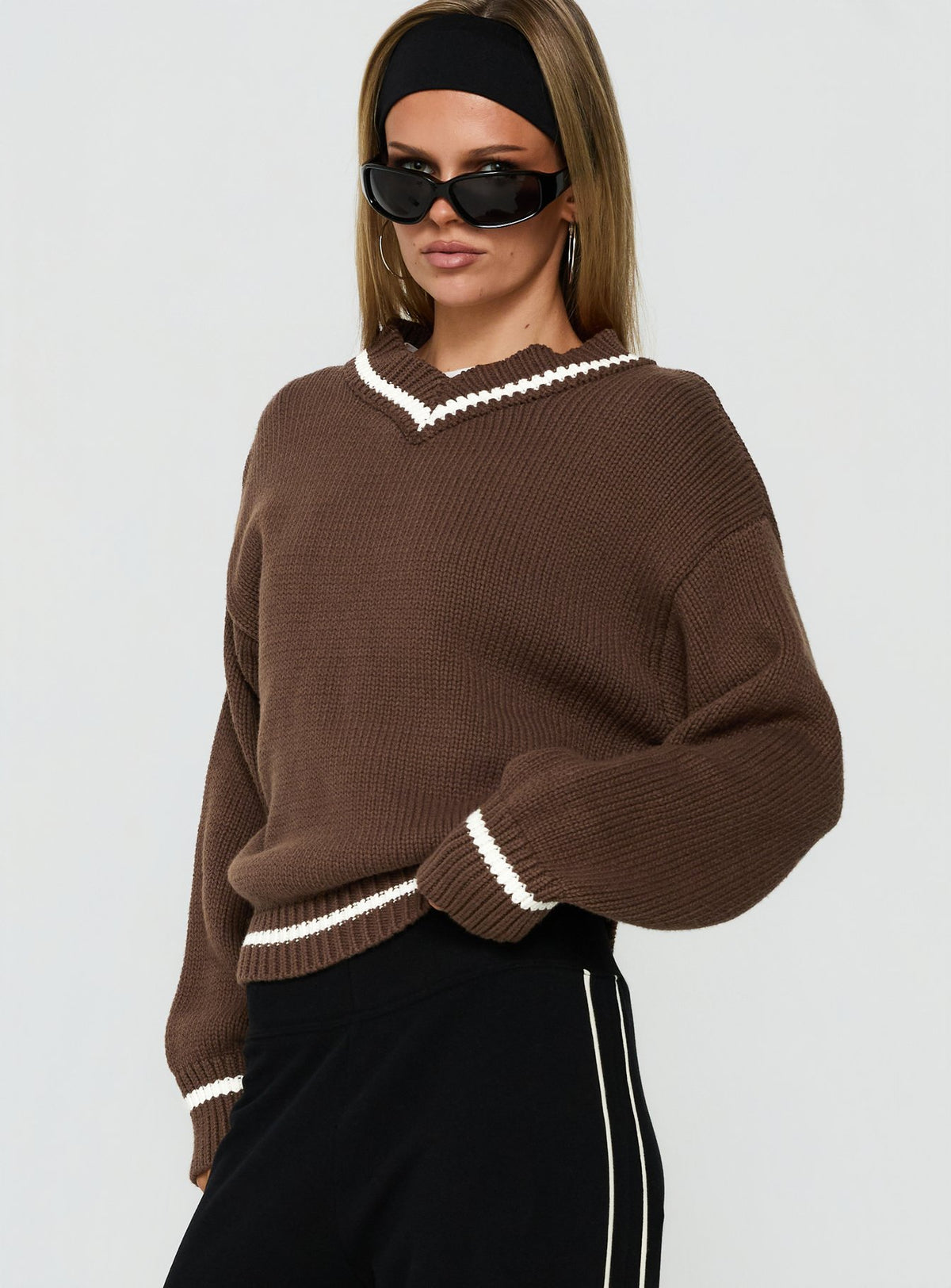 Designed with the Myrandah V Neck Long Sleeve Knit Jumper Chocolate Stripe in womens-jumpers featuring short length and oversized fit detail view of model wearing Princess Polly