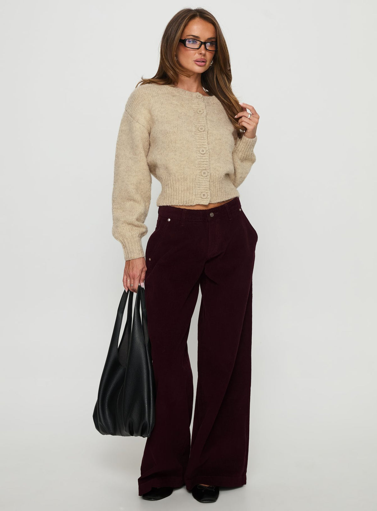 side view of model wearing Princess Polly Jacynda Low Waist Wide Leg Corduroy Jeans Currant Mid Rise Jeans Jeans 