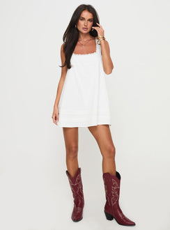 side view of model wearing Princess Polly Alanah Mini Dress White Petite Square Neck 