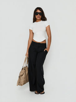 Featuring the Loved Up Low Rise Baggy Pants Black Tall in womens-regular-pants with low-rise waist front view of model wearing Princess Polly