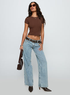 front view of model wearing Princess Polly Ellanor Low Rise Slouch Denim Jean Light Blue Low Rise Jeans 