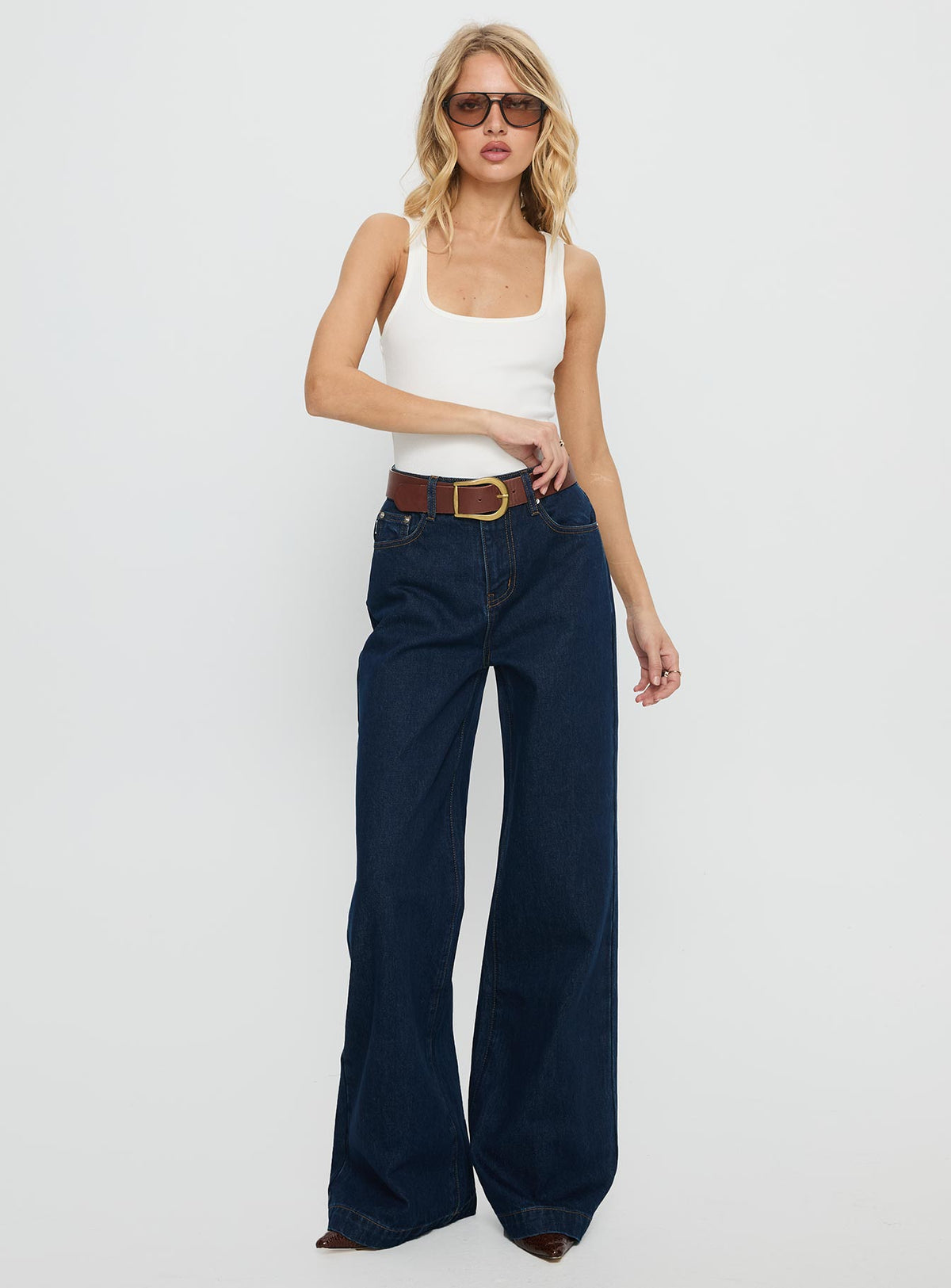 front view of model wearing Princess Polly Goldie High Rise Wide Leg Jeans Indigo High Rise Jeans Jeans 