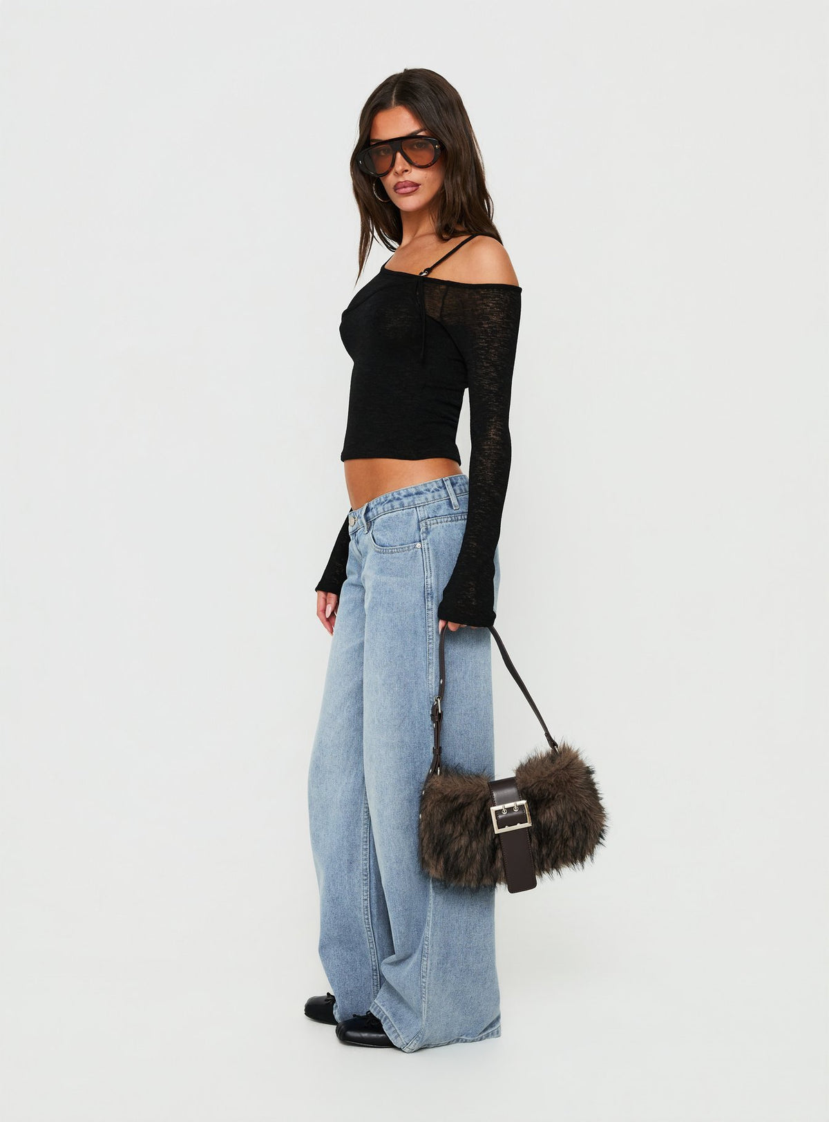 Styled Picco Ultra Low Rise Wide Leg Jeans Light Blue Wash Petite in womens-jeans with a low-rise waist side view of model wearing Princess Polly