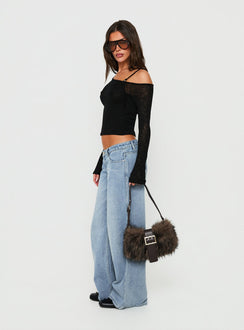 Styled Picco Ultra Low Rise Wide Leg Jeans Light Blue Wash Petite in womens-jeans with a low-rise waist side view of model wearing Princess Polly