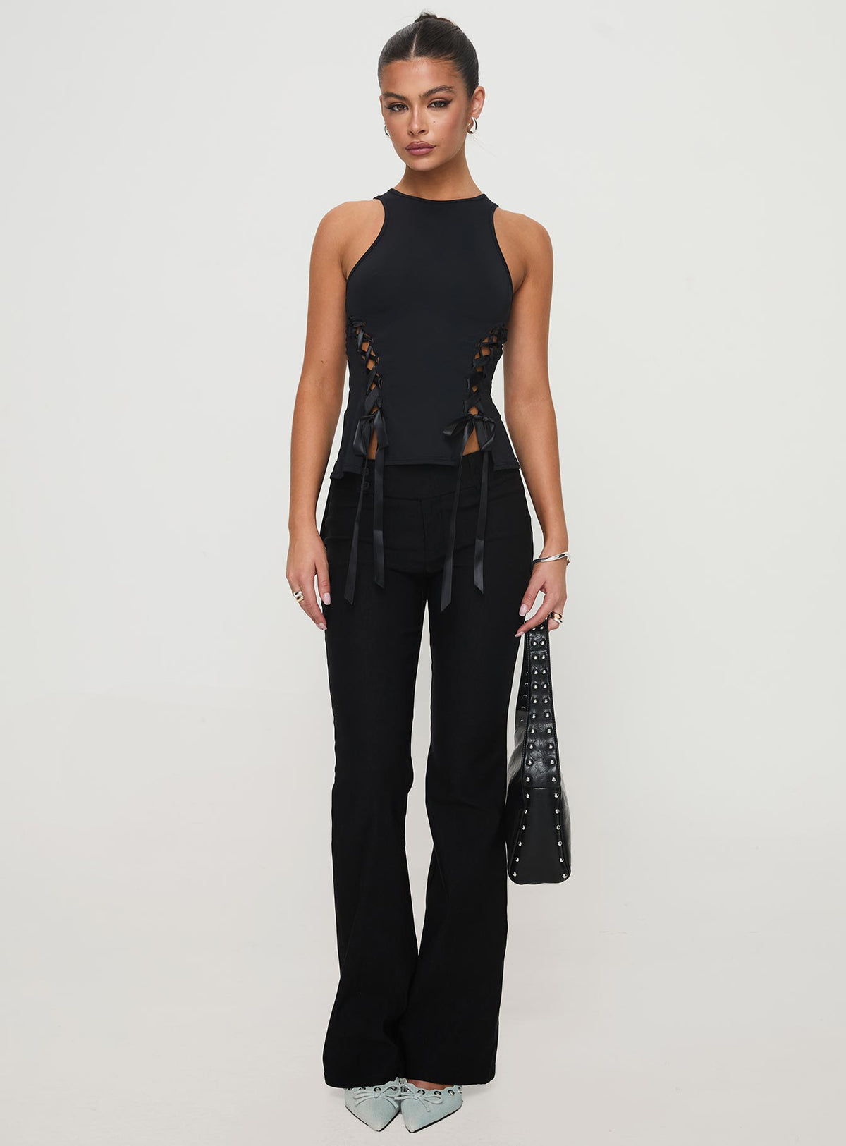 front view of model wearing Princess Polly Bisous Top Black Sleeveless Crew Neck 