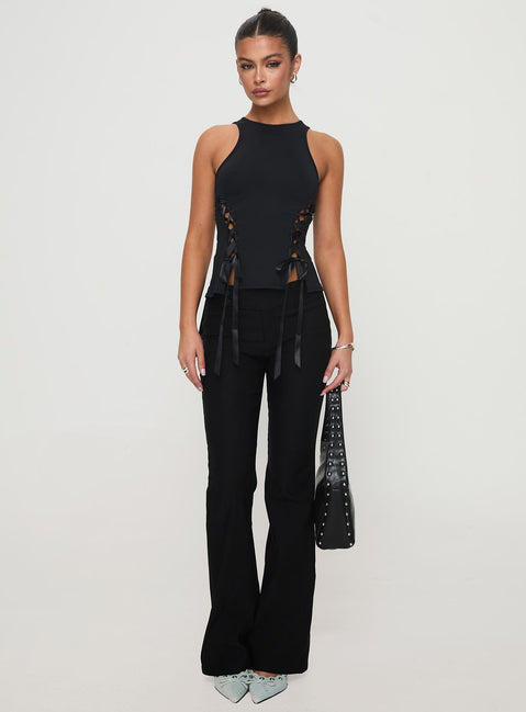 front view of model wearing Princess Polly Bisous Top Black Sleeveless Crew Neck 