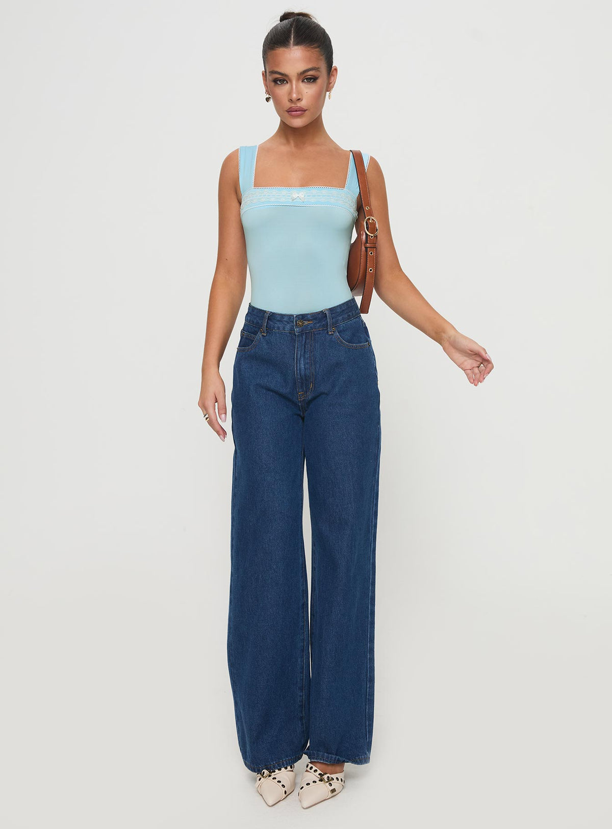 front view of model wearing Princess Polly Keating Bodysuit Baby Blue Sleeveless Bodysuit 