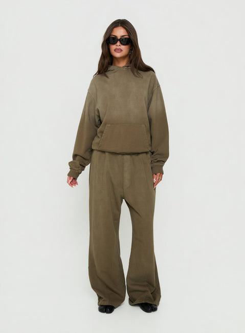 Showcasing the AT Fleece Baggy Sweatpant Washed Olive in womens-regular-pants with mid-rise wide-leg styling front view of model wearing Princess Polly