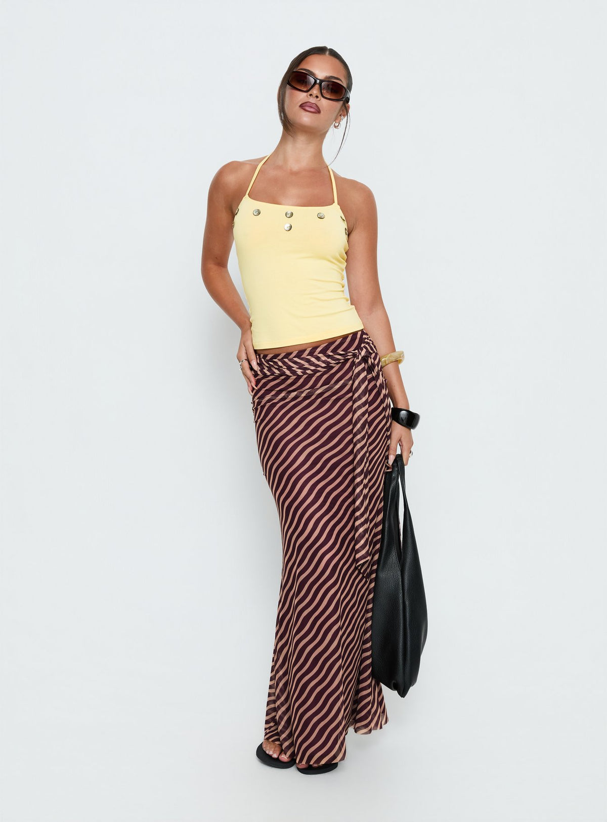   front view of model wearing Princess Polly Caviar Tie Maxi Skirt Brown Stripe Maxi Skirts Skirts 