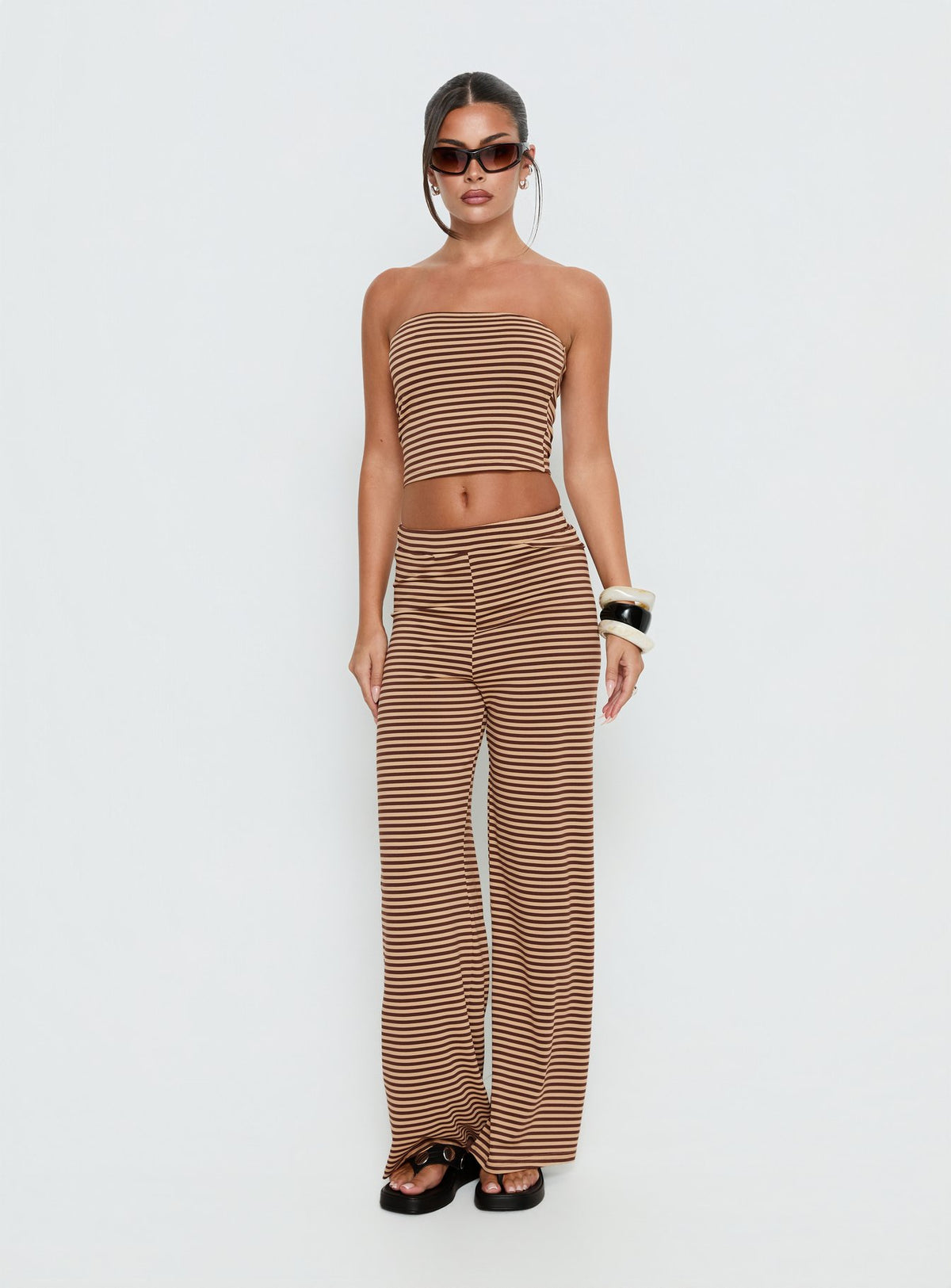 side view of model wearing Princess Polly Timora Pants Brown Stripe Mid Rise Pants Pants 