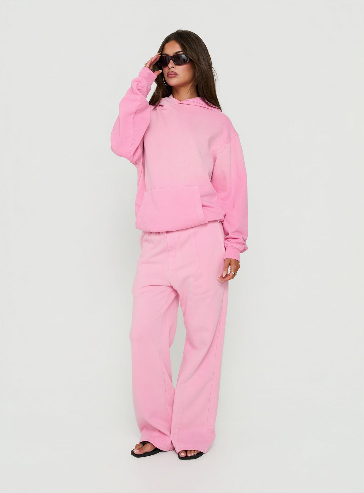 Presenting the AT Pullover Oversized Hoodie in Washed Pink womens-jumpers with long length and hooded neckline side view of model wearing Princess Polly