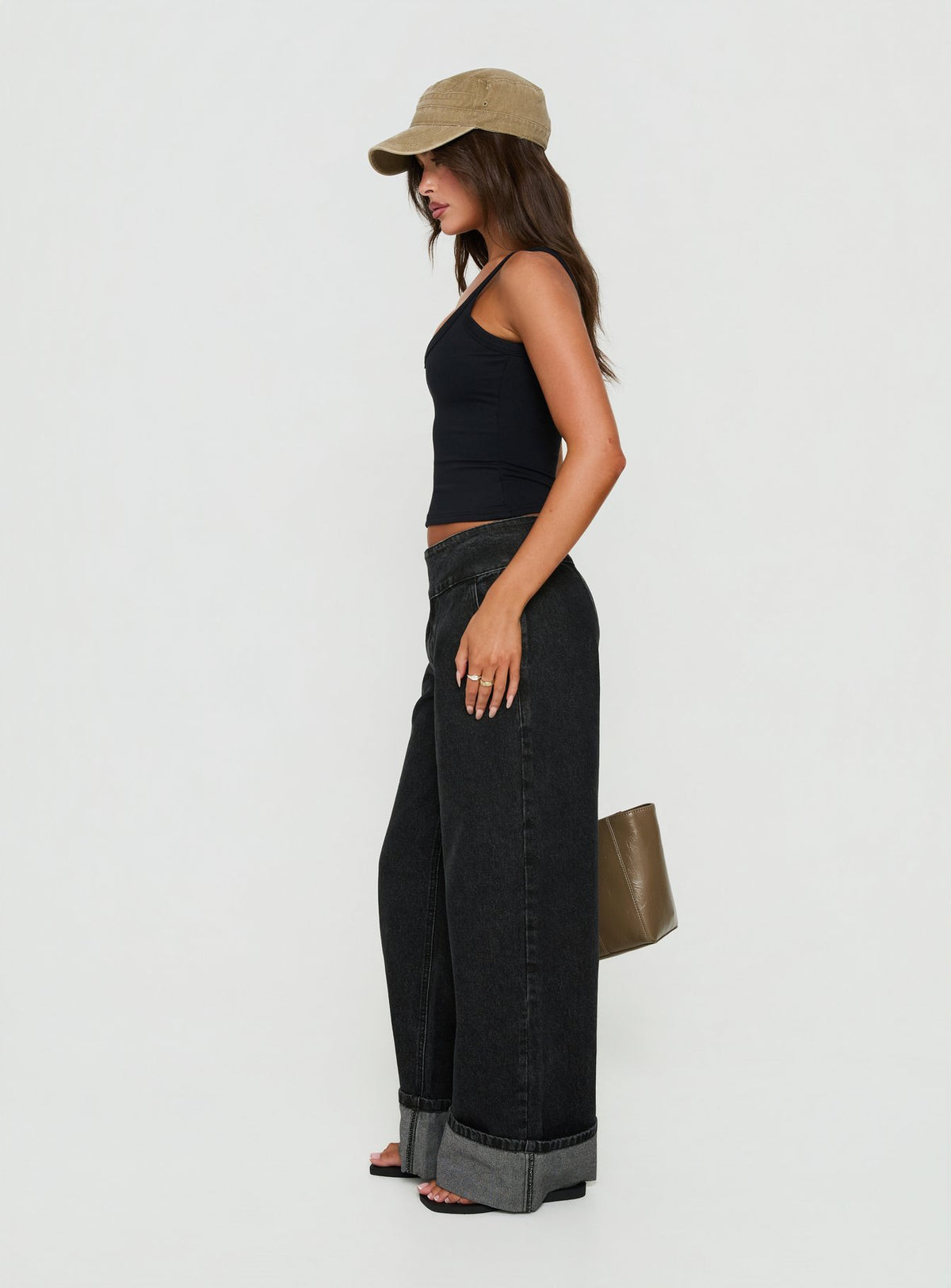 Crafted with the Nikoletta Foldover Jeans Washed Black in high-rise wide-leg design side view of model wearing Princess Polly