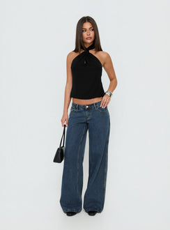 Showcasing the Picco Ultra Low Rise Wide Leg Jeans Dark Blue Wash Petite in womens-jeans with low-rise waist front view of model wearing Princess Polly