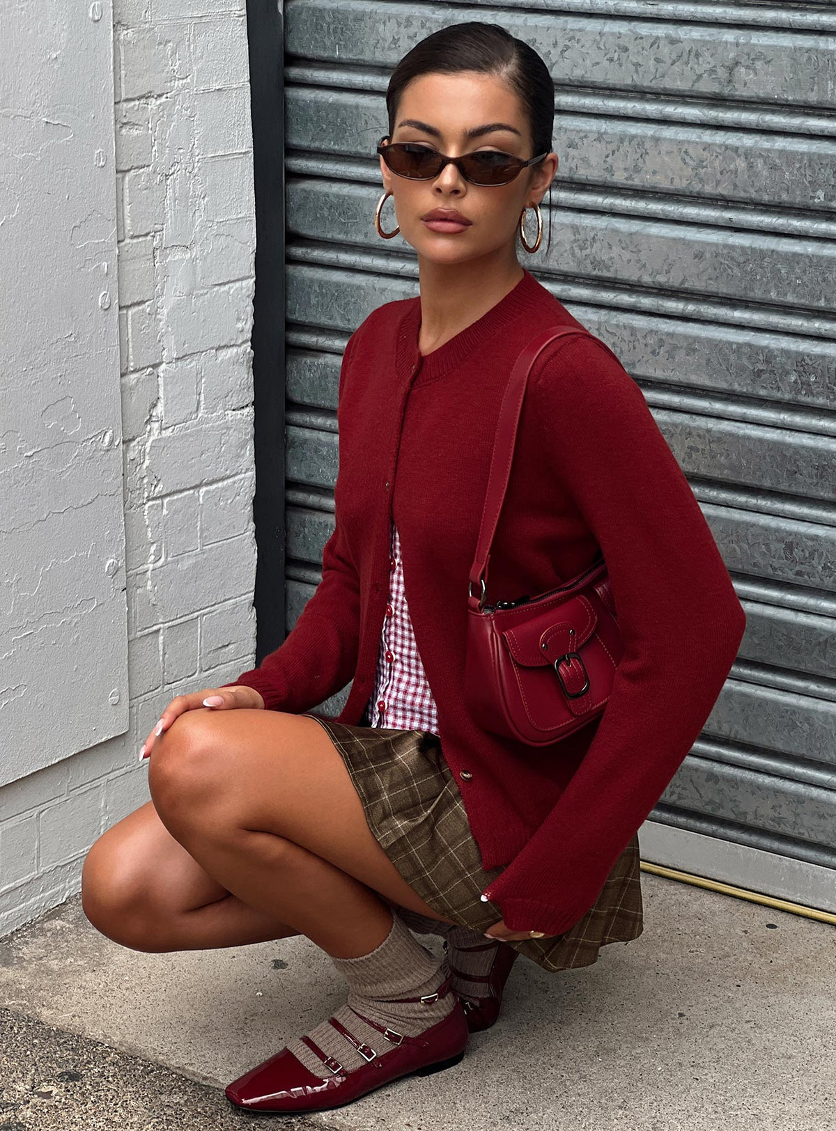 side view of model wearing Princess Polly Arica Button Up Knit Cardigan Red Longline Jumpers Jumpers 