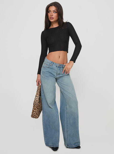 front view of model wearing Princess Polly Demie Mid Rise Wide Leg Jeans Light Blue Wash Low Rise Jeans Jeans 