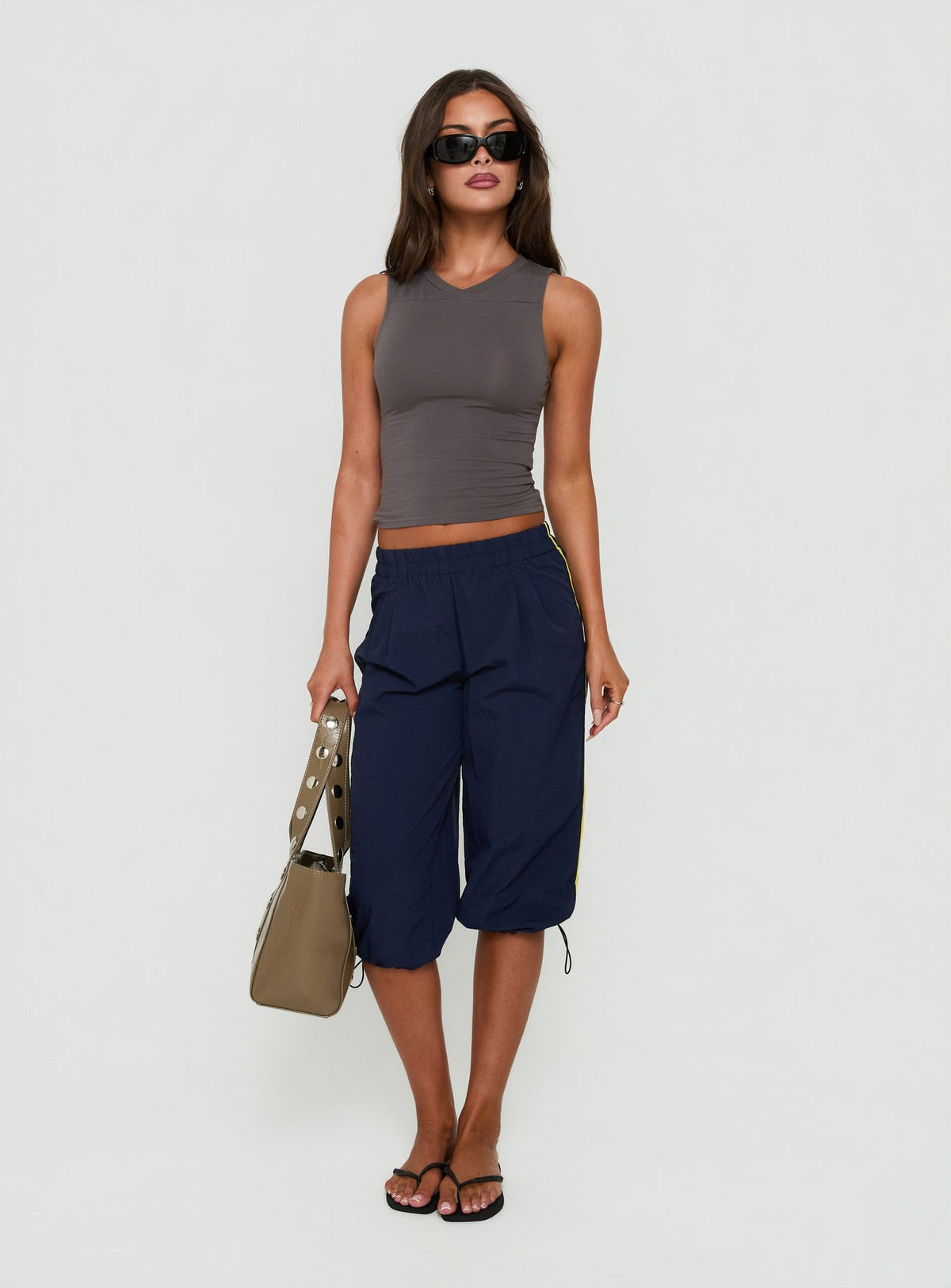 Experience the Riyah 3/4 Low Rise Nylon Pants Navy in womens-regular-pants with stripe design detail view Princess Polly