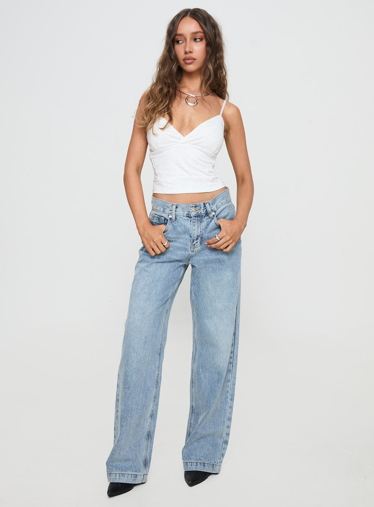 front view of model wearing Princess Polly Anelli Low Rise Straight Leg Jeans Light Blue Wash High Waisted 