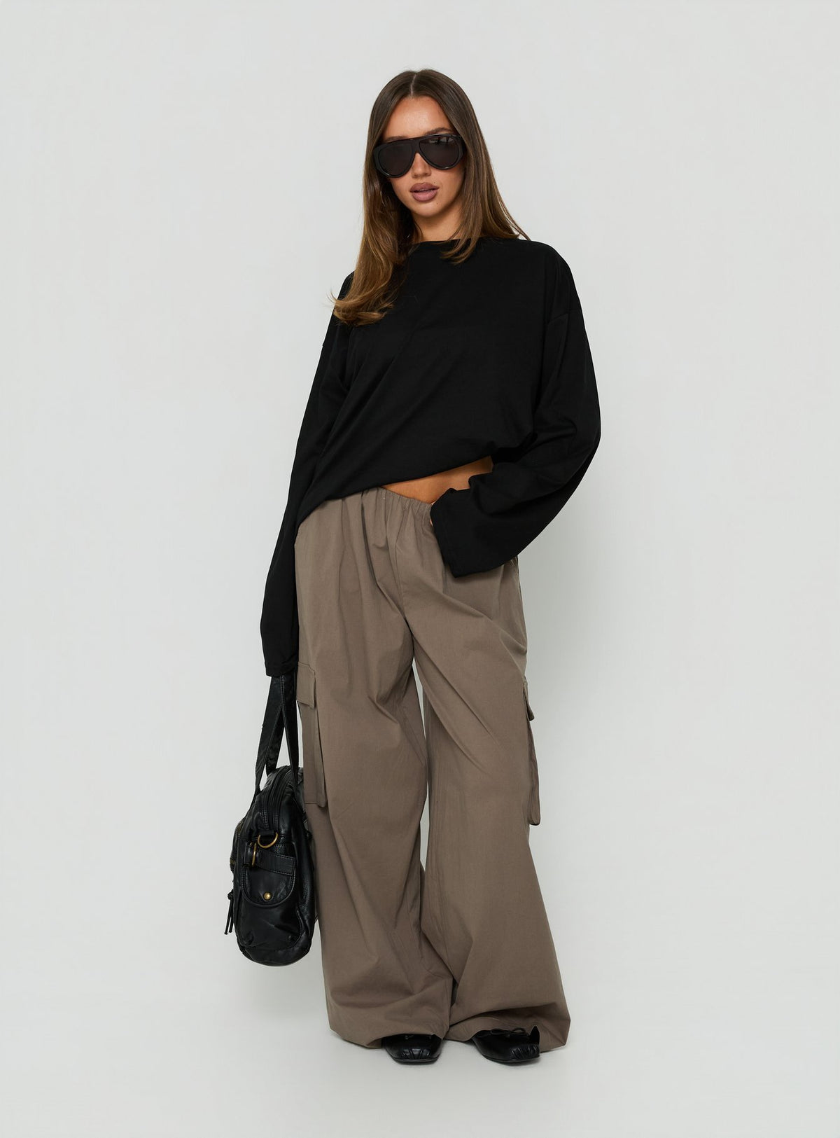 Showcasing Lunea Concealed Waistband Cargo Pants Charcoal womens-regular-pants with mid-rise front view of model wearing Princess Polly