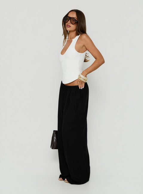Crafted with Peacemaker Tie Waist Relaxed Pants Black in womens-regular-pants featuring mid-rise side view of model wearing