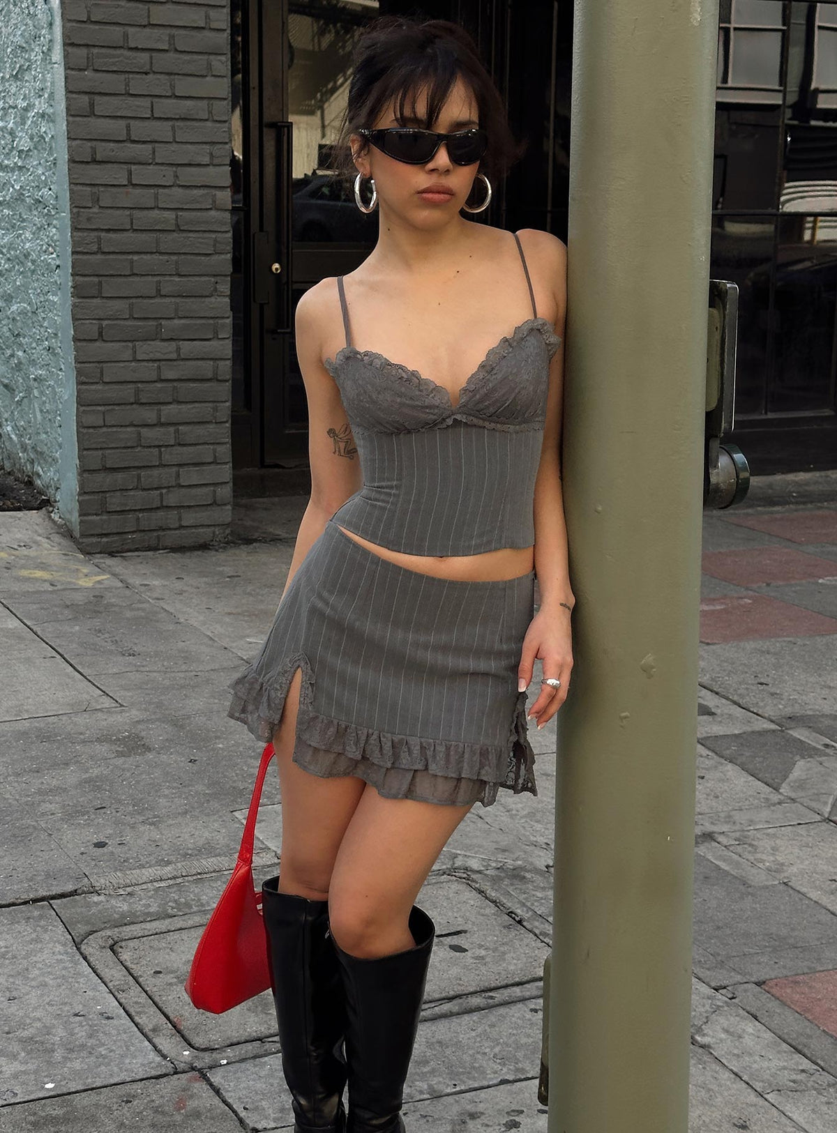 Front view of model wearing  front Princess Polly Sleeveless High Neck  Ferran Corset Top Grey Pinstripe