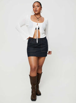   front view of model wearing Princess Polly Hughes Mini Skirt Dark Wash Denim Petite Mini Skirts Skirts 