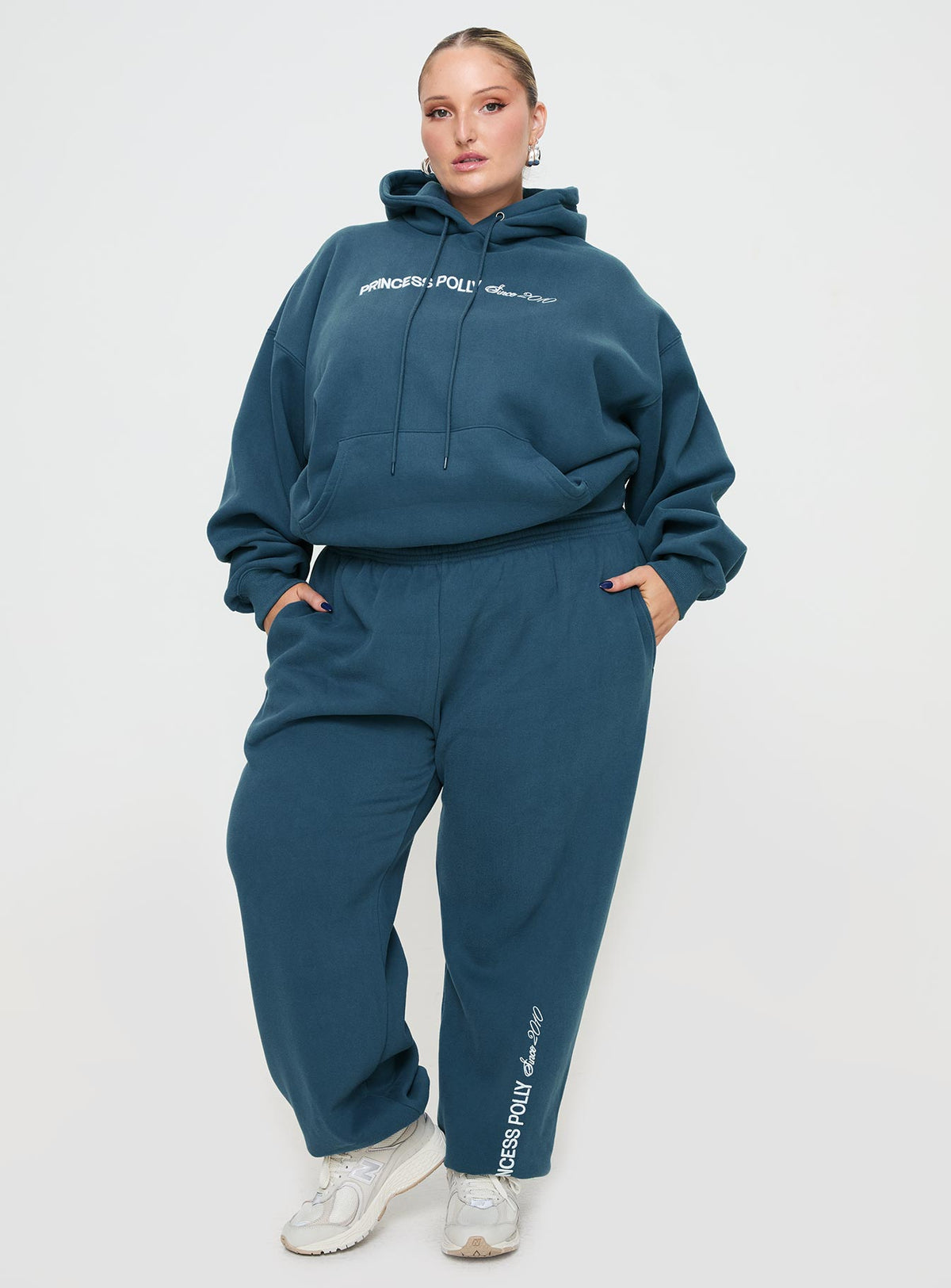 front view of model wearing Princess Polly Princess Polly Hooded Sweatshirt Block / Cursive Text Slate Curve Jumpers 