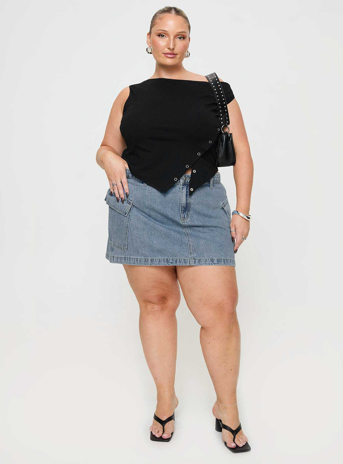   front view of model wearing Princess Polly Zakai Cargo Denim Mini Skirt Light Blue Denim Curve Mini Skirts Skirts 