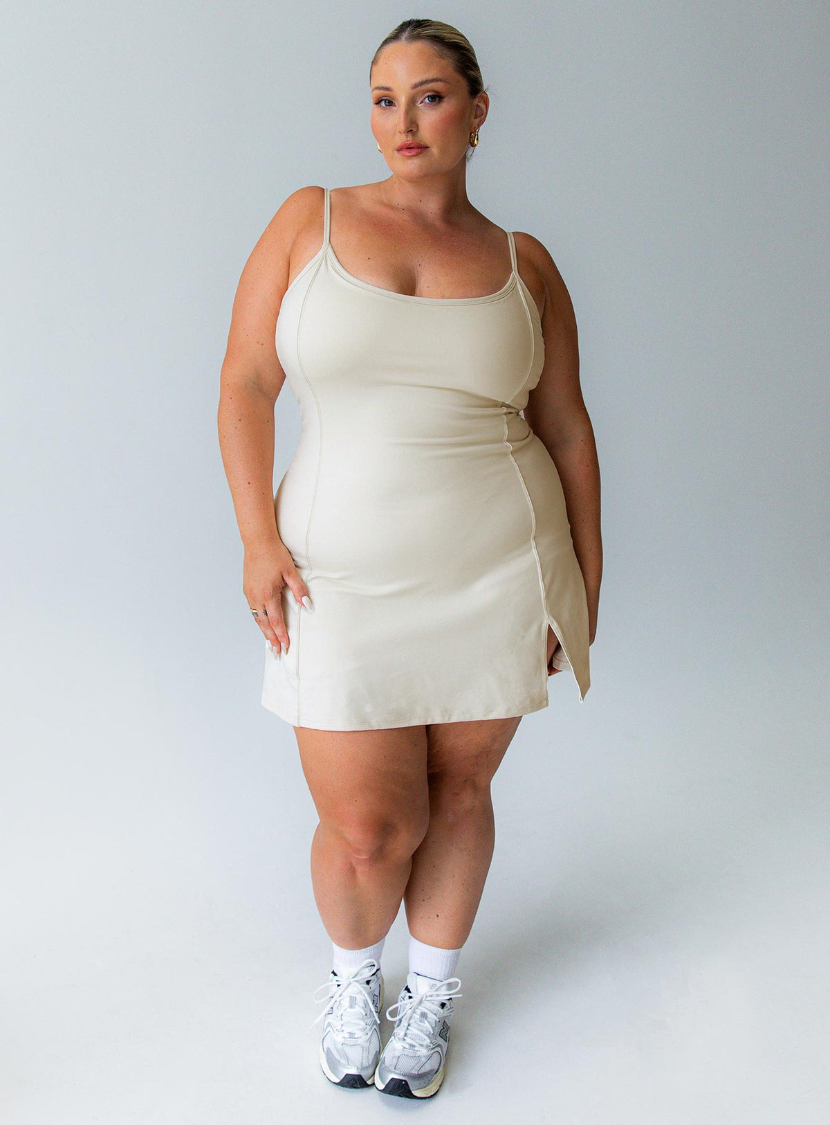 Beige activewear dress flattering scoop-neck shape that feels comfortable and unrestrictive built in shorts