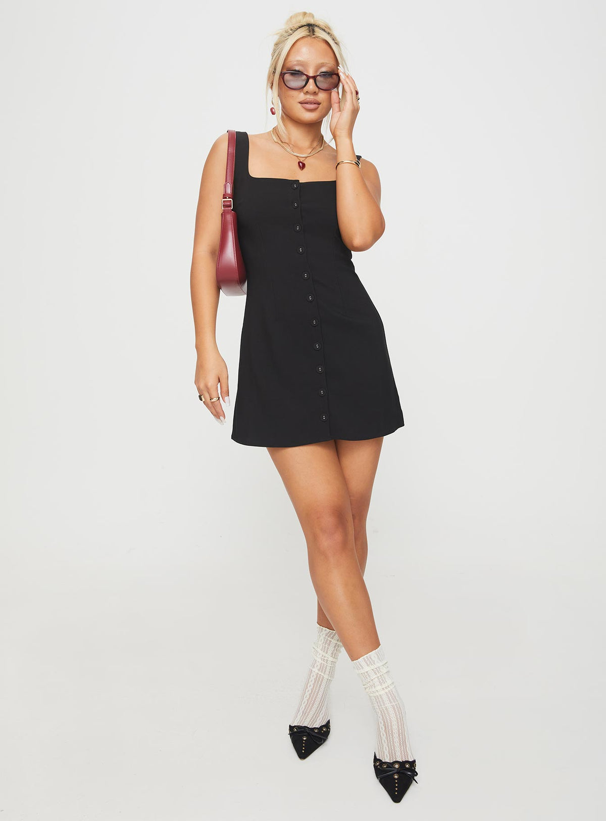 front view of model wearing Princess Polly Zamie Mini Dress Black Square Neck 