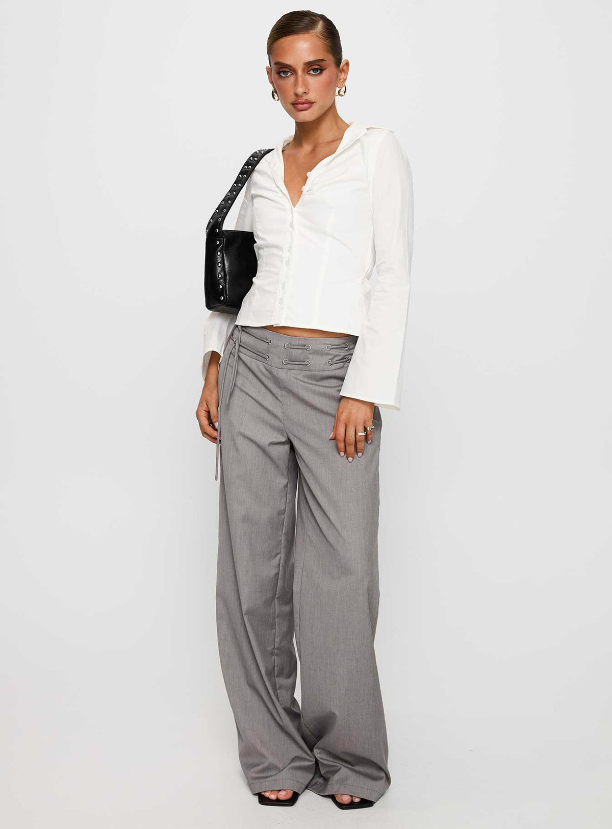 side view of model wearing Princess Polly Arianwyn Long Sleeve Shirt White Full Sleeves V-Neck 
