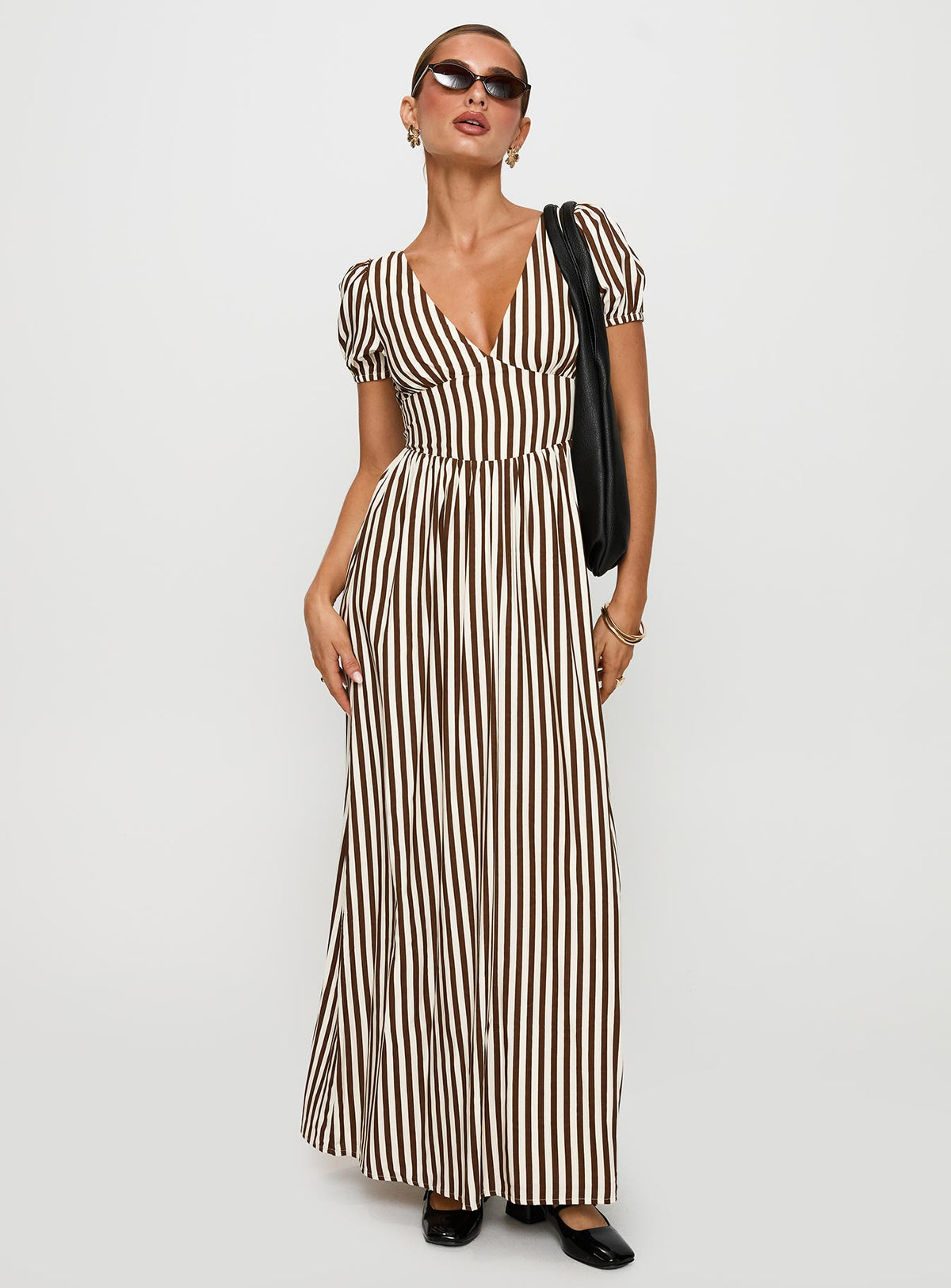 side view of model wearing Princess Polly Collyns Maxi Dress Beige Pinstripe V-Neck 