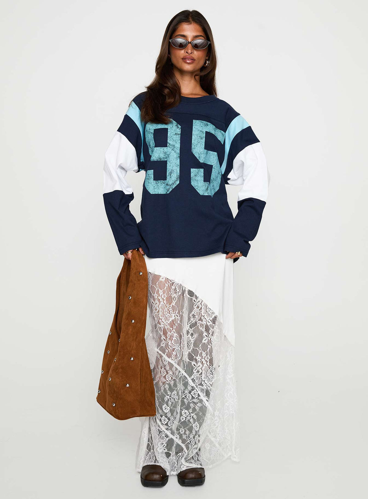front view of model wearing Princess Polly Collegiate Queen Long Sleeved Top Navy Full Sleeves Crew Neck 