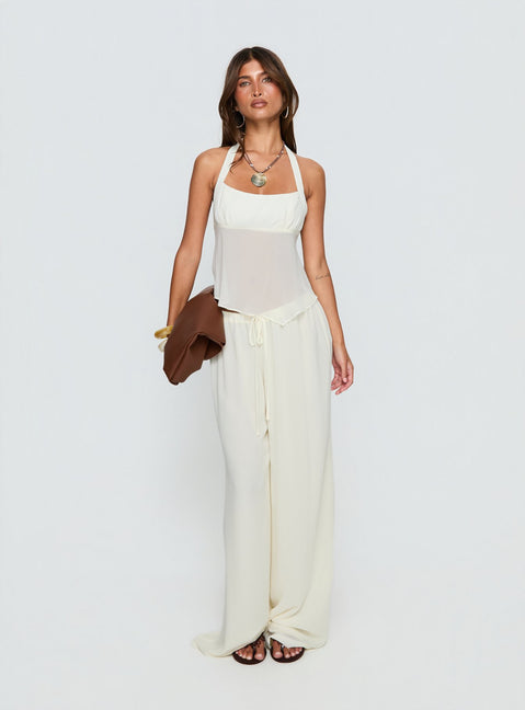 Showcasing the Finesse Pants Yellow womens-regular-pants with mid-rise front view of model wearing Princess Polly