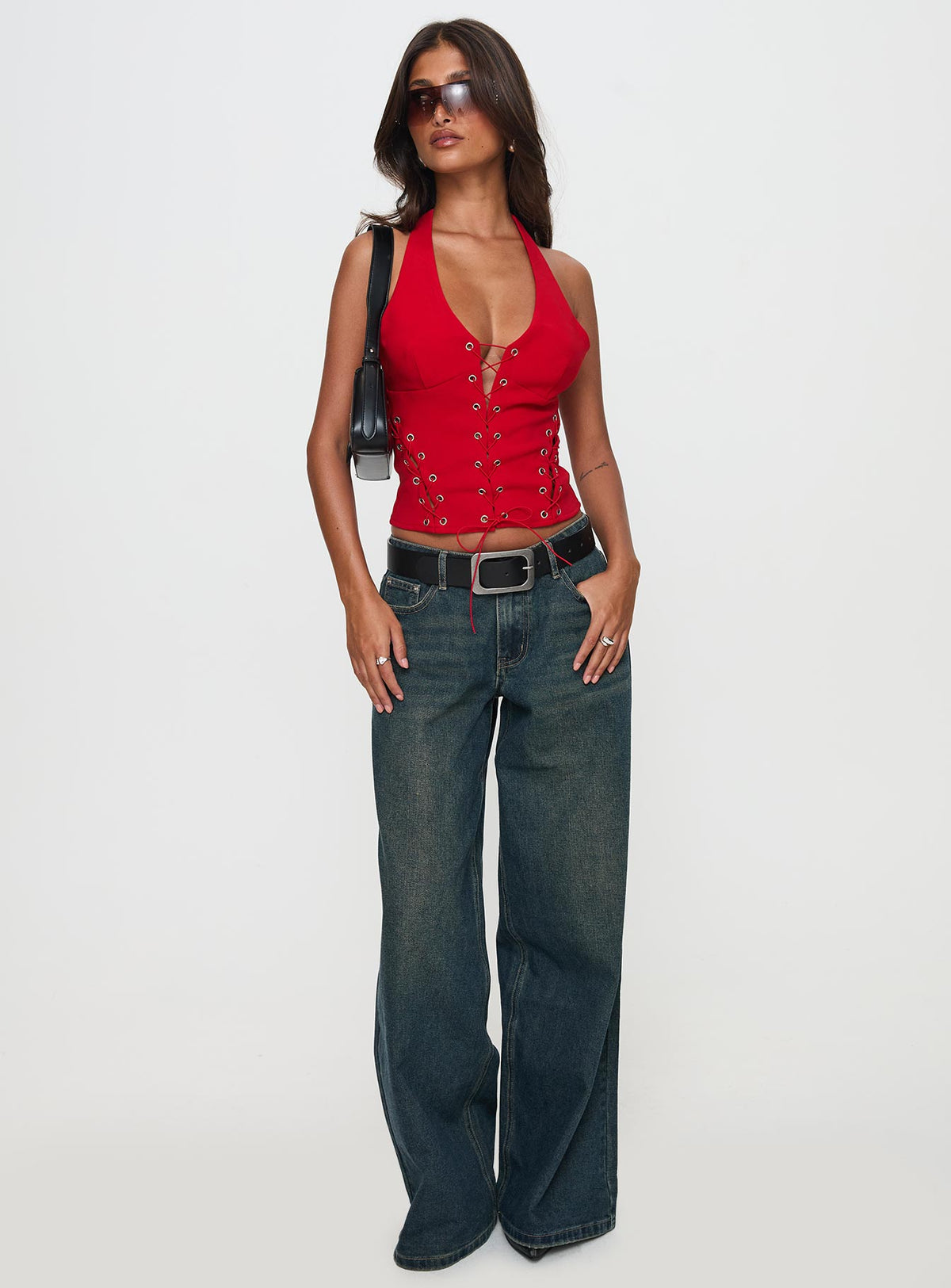 side view of model wearing Princess Polly Come See Me Tie Up Halter Top Red Sleeveless Plunger 