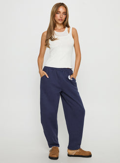 front view of model wearing Princess Polly Route 08 Barrel Track Pant Navy Mid Rise Pants Pants 