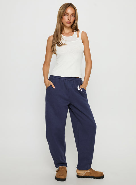 front view of model wearing Princess Polly Route 08 Barrel Track Pant Navy Mid Rise Pants Pants 