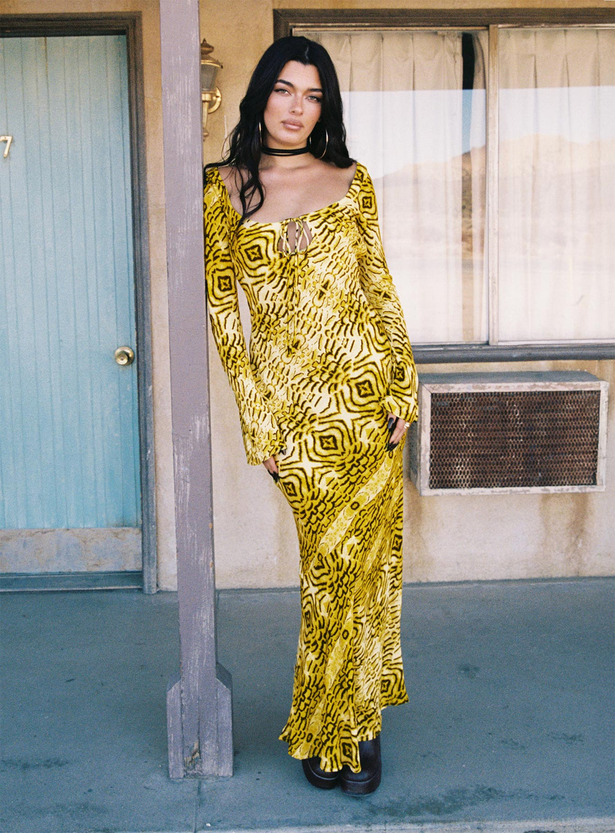 side view of model wearing Princess Polly Setting Sun Long Sleeve Maxi Dress Yellow / Black Scoop Neck 